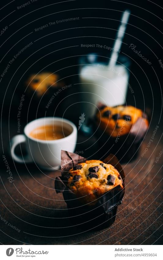 Chocolate muffins, milk and coffee cup on dark background baked breakfast butter cake chocolate cupcake dessert food sweet fresh delicious tasty yummy calories