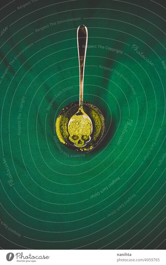 Halloween theme concept image with a skull shape spoon with green dust on it halloween creepy poison background witch venomous mysterious recipe toxic danger
