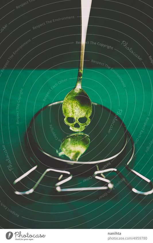 Halloween theme concept image with a skull shape spoon with green dust on it halloween creepy poison background witch venomous mysterious recipe toxic danger