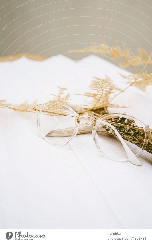 Boho style background with neutral tones a dry fern, a deer horn and retro glasses vintage wild boho decoration still life beige paper texture wallpaper