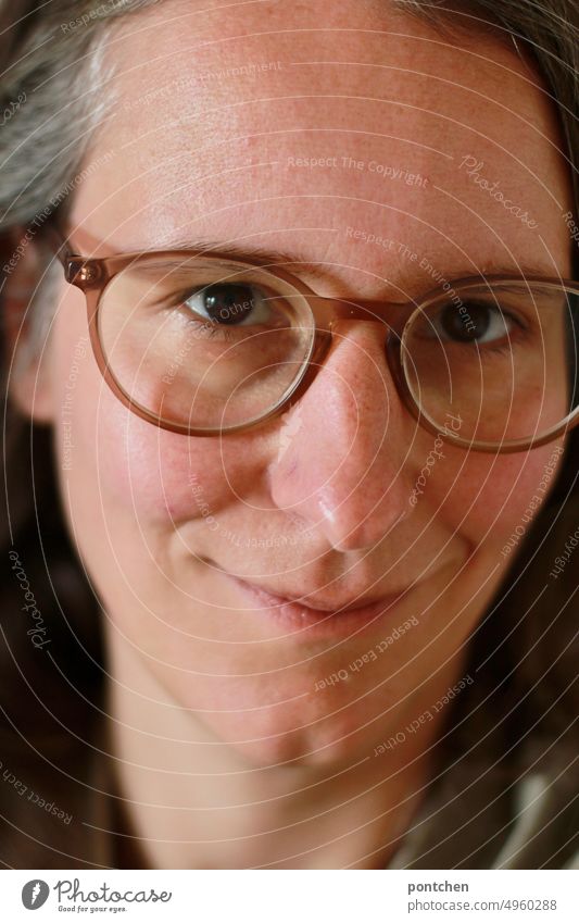 Portrait of smiling woman with glasses and gray temples. Woman Smiling Eyeglasses gray hair sleep portrait Without makeup naturally Adults Face Feminine