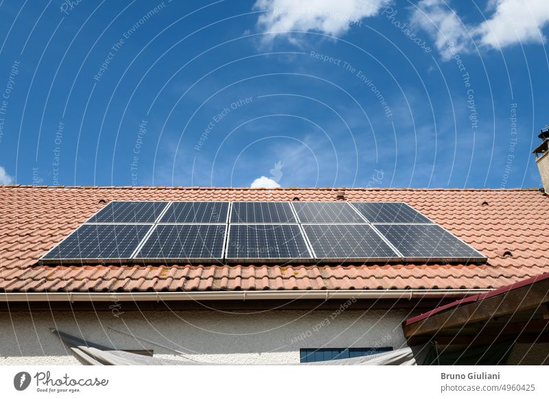 Photovoltaic panels installed on the roof of a house. Solar panels on a roof. photovoltaic environmental power renewable energy electricity solar technology