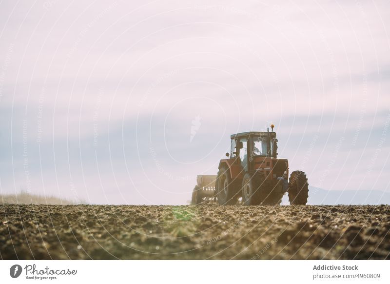 Old tractor working on the field agriculture agro countryside cultivation farm harvest land machine outdoor plant plow rural rustic rye sky sunny Tractor
