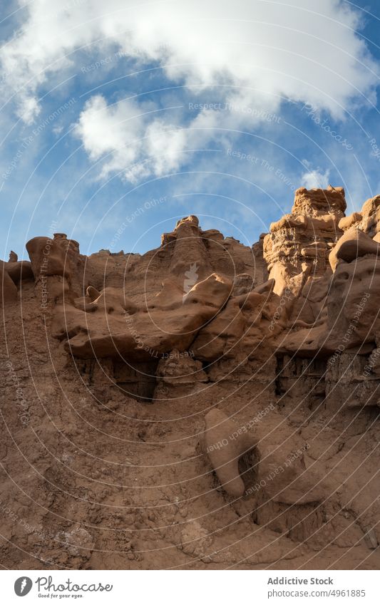Hoodoos against cloudy blue sky hoodoo sandstone formation daytime arid desert terrain landscape goblin valley state park usa utah united states america rock