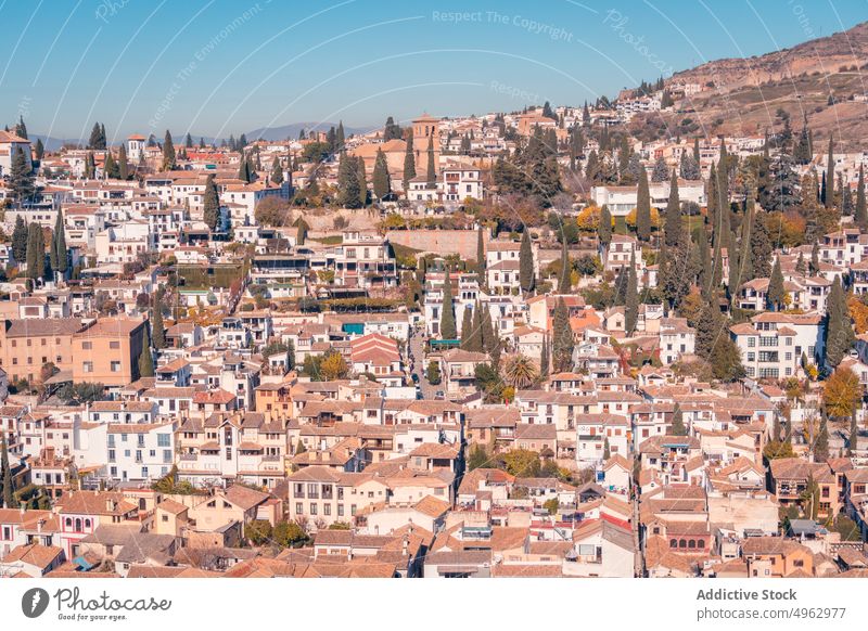Houses and trees against cloudless sky house street city residential building autumn mountain cityscape granada andalusia spain fall season structure town