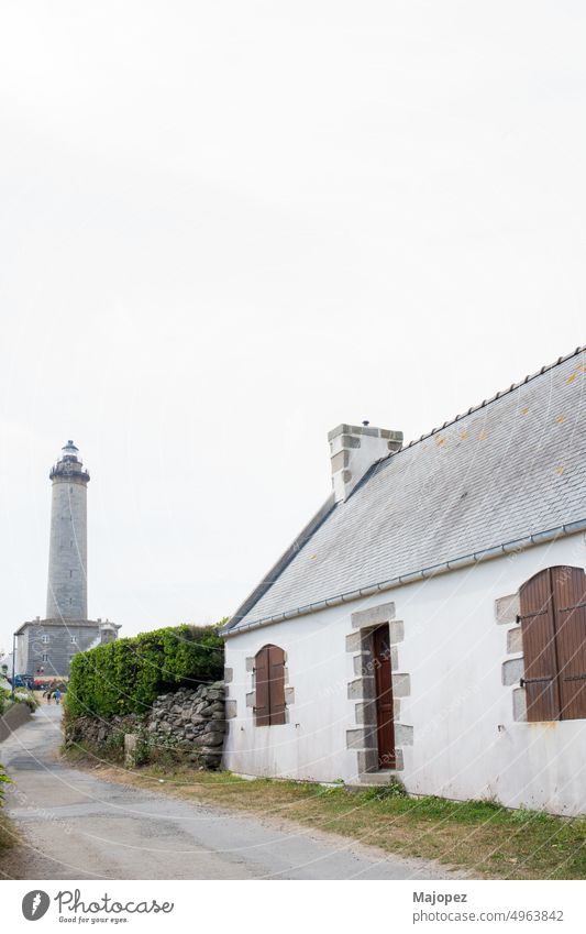 Batz island. Traditional architecture and lighthouse in the distance stone view aerial view agriculture atlantic batz brittany building coast coastal copy space