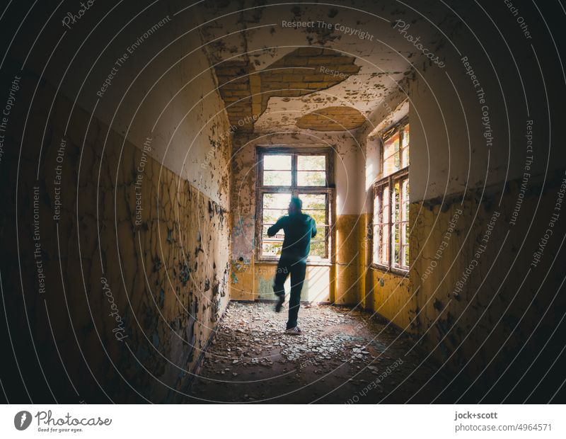 Abandoned and lost moves Man Rear view Movement motion blur Room Architecture Ruin Derelict Ravages of time Apocalyptic sentiment Transience lost places Old