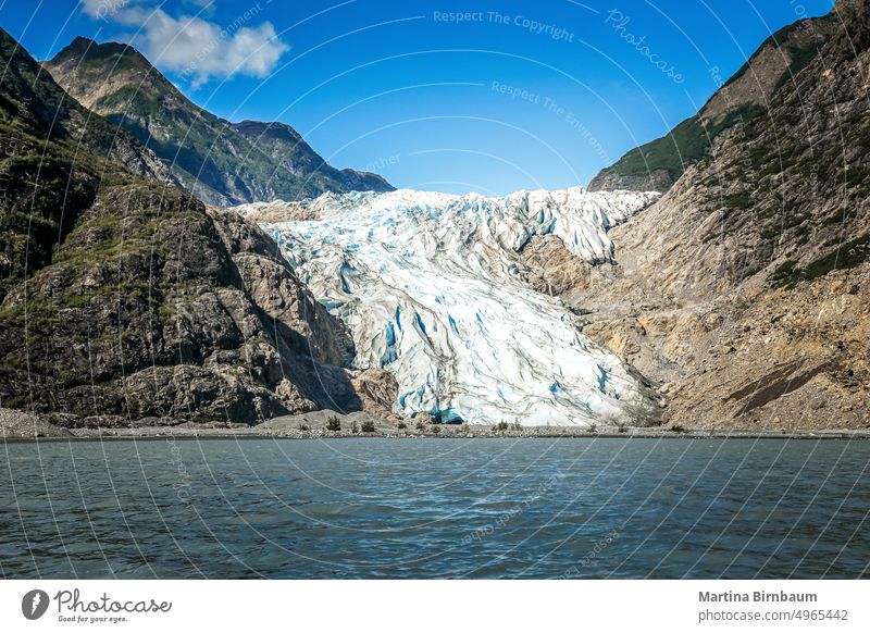 The Chilkat Glacier in Alaska, USA chilkat glacier glacial alaska wilderness landscape river blue texture klehini nature rock summer melting global tourism