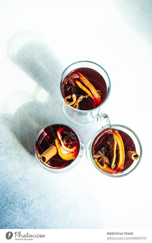 Mulled wine with spices anise star berry beverage christmas cinnamon spicy drink festive holiday mulled orange traditional red slice sticks winter ingredient