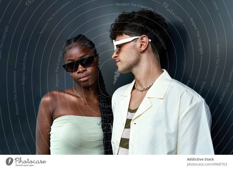 Cool diverse models in sunglasses couple trendy style fashion portrait appearance modern together cool accessory personality individuality black