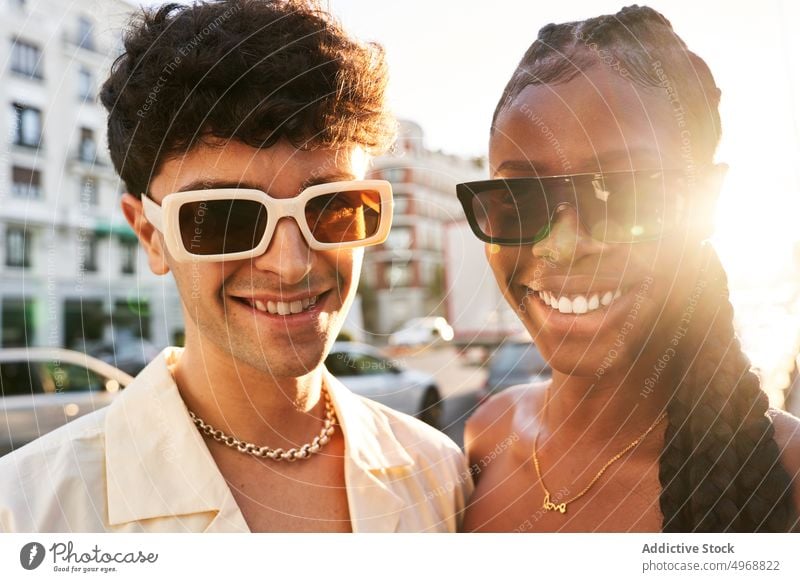 Young multiethnic couple on street style urban smile happy urbansunlit together appearance portrait girlfriend boyfriend diverse multiracial black