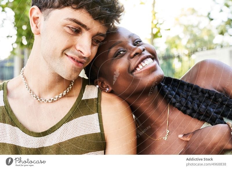 Black woman leaning on shoulder of boyfriend couple love date street summer glad smile tender romantic together happy relationship girlfriend african american