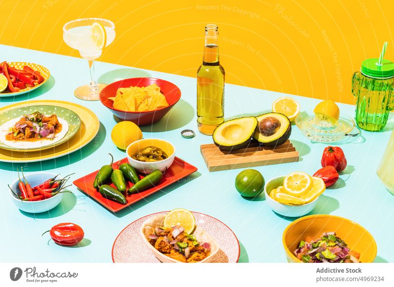 Table with assorted Mexican food and drinks tradition table composition dish cuisine colorful bright mexican nacho salad chicken fried gourmet bowl yummy serve