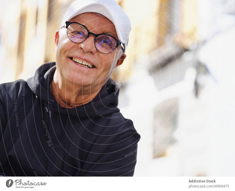 Tranquil senior man in casual wear in city cheerful smile happy street handsome tranquil style trendy elderly male fashion serious urban confident aged