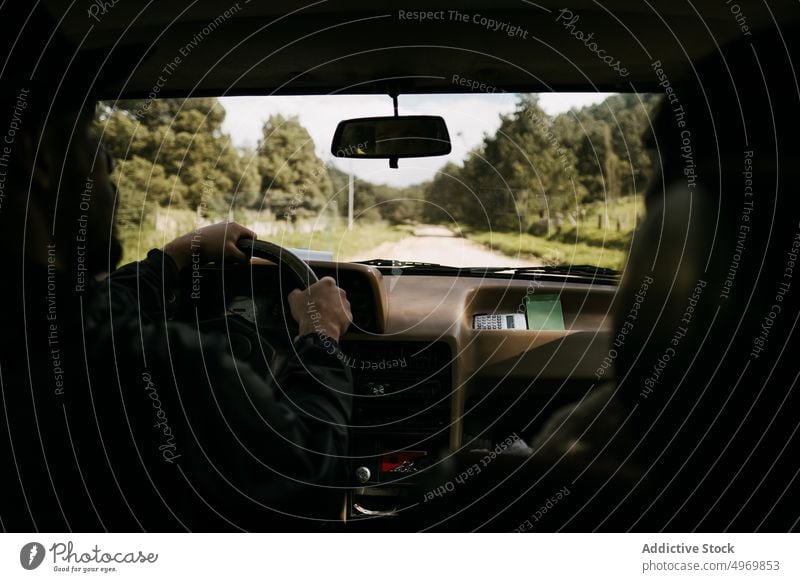 Travelers driving car along road in woods traveler road trip together drive ride forest route nature vehicle transport journey automobile summer adventure