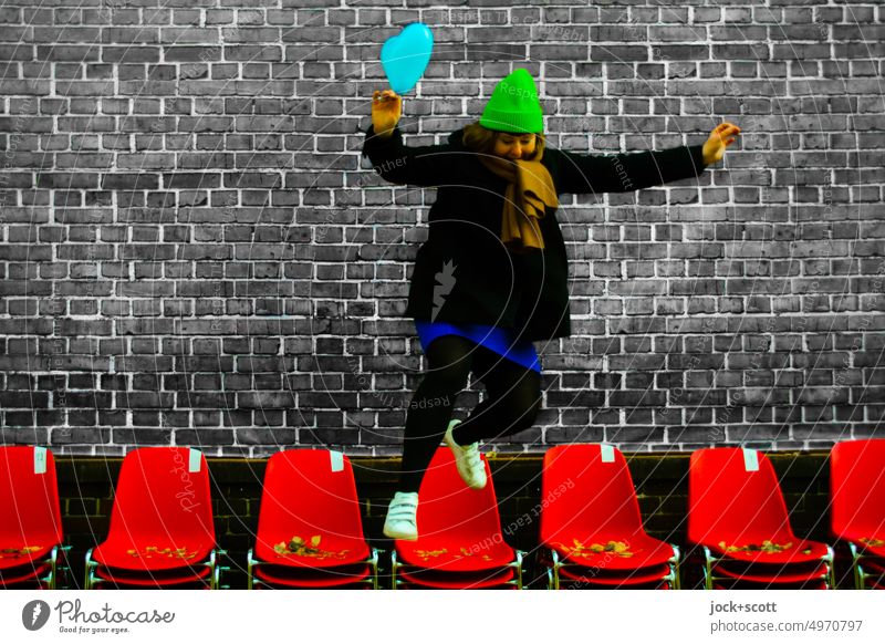 jump free from the row of chairs Woman Human being Jump Freedom Movement Joie de vivre (Vitality) Row Row of chairs Brick wall Design Balloon winter jacket Cap
