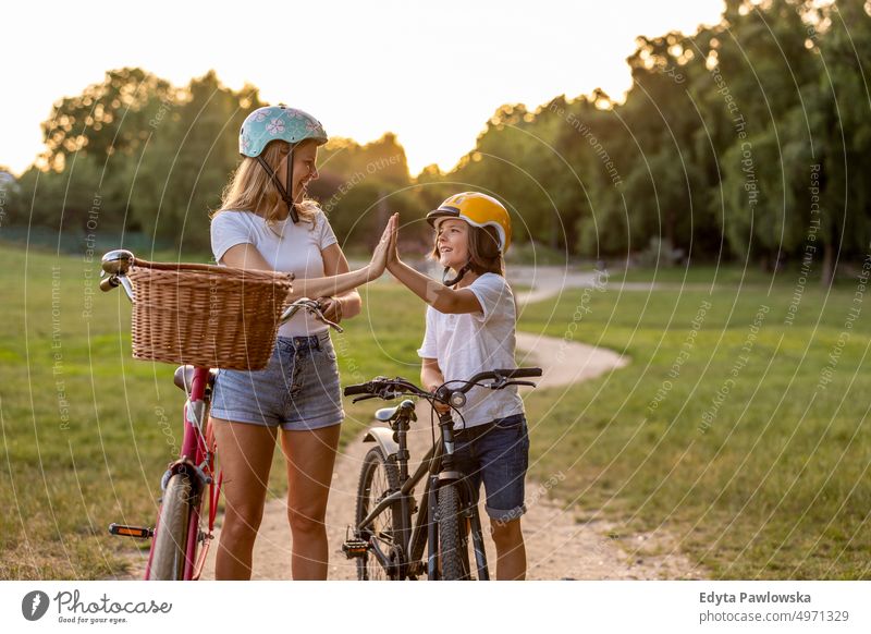 Mother and son enjoying a bike trip together day healthy lifestyle active lifestyle outdoors fun bicycle cycling biking activity cyclist ecological people happy