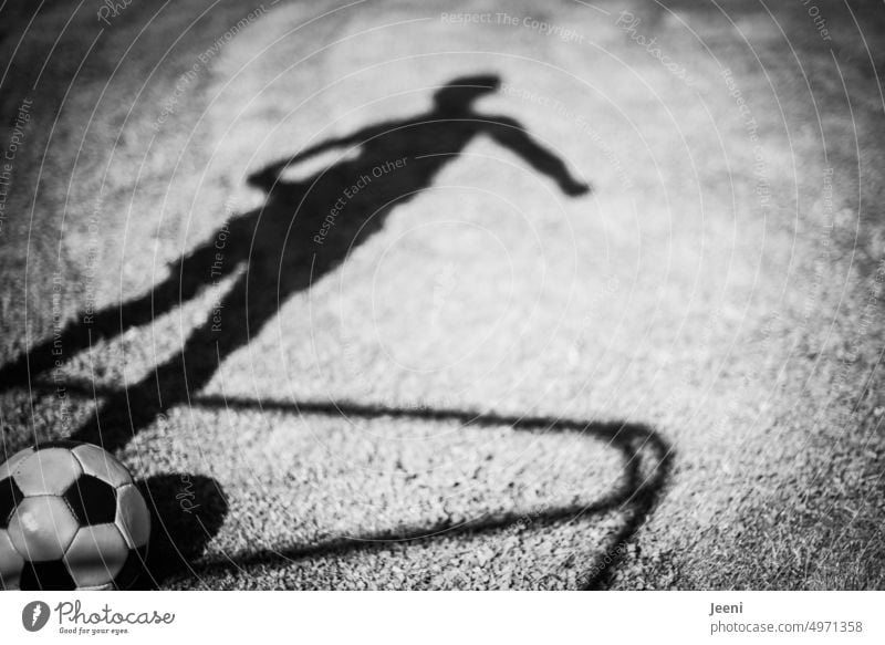 Strong game Foot ball Football pitch Goal Ball Ball sports Legs Body Athletic Sportsperson Soccer player Human being Boy (child) Shadow shadow cast