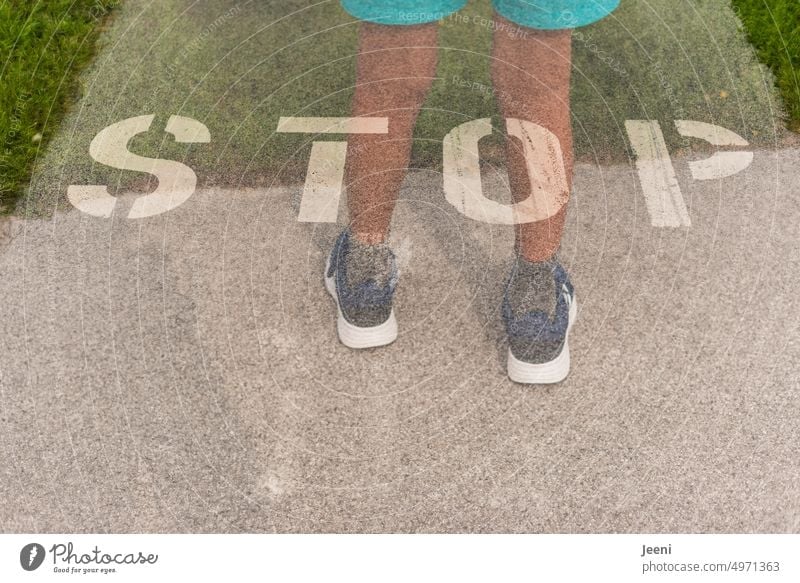 STOP along the way stop Stop Word Hold Street Sign Transport Lanes & trails Child Human being Legs feet Double exposure Signs and labeling Safety Clue