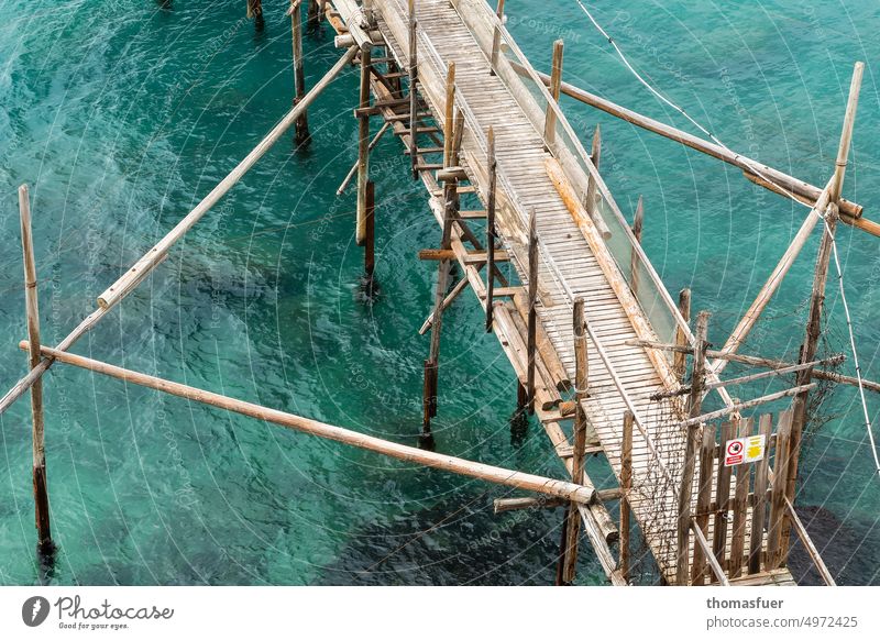 the rhombus times differently. Wooden jetty in the Adriatic Sea Blue Eco-friendly Ecological Ocean Footbridge Bridge Wood construction Water coast fishing