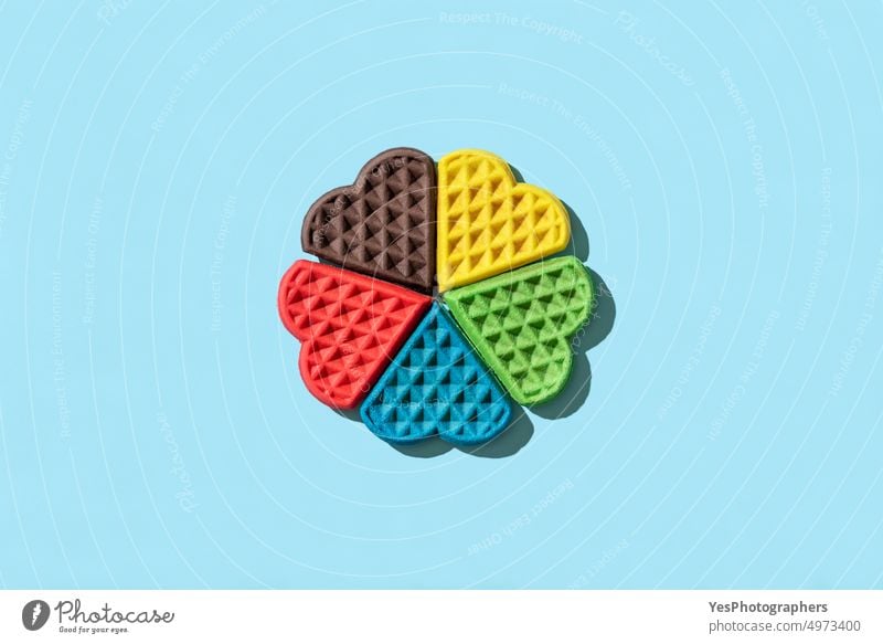 Rainbow waffles top view on a blue background. above aligned belgian biscuits black breakfast bright brown child chocolate color colors creative cuisine cute