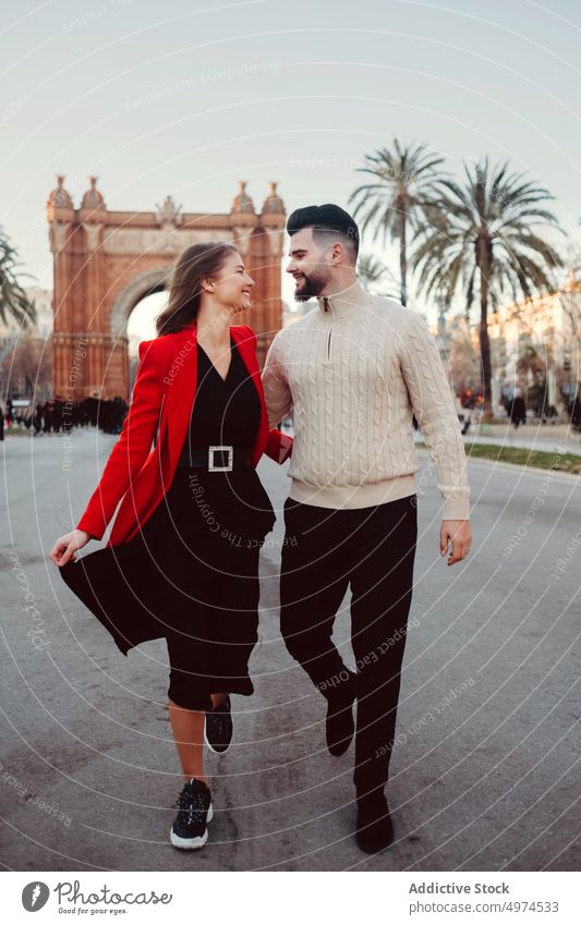 young attractive couple walking in the city urban barcelona holding hands dating man street people love woman girl lifestyle spain black tourism vacation