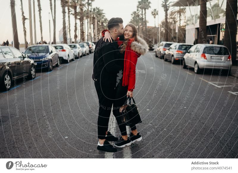young attractive couple walking in the city urban barcelona holding hands dating man street people love woman girl female travel spain romantic beautiful modern