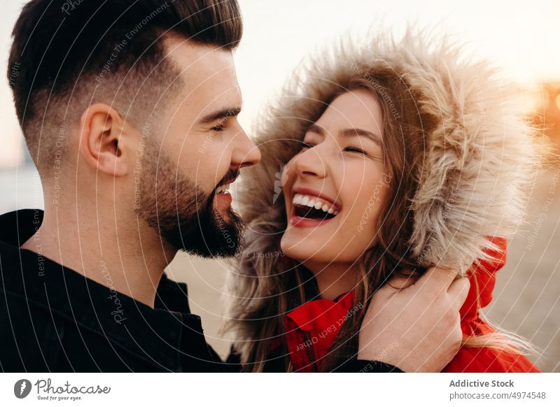 young romantic couple laughing love smiling dating winter guy girl people friends happy woman boyfriend cold girlfriend fun outdoors good husband beautiful