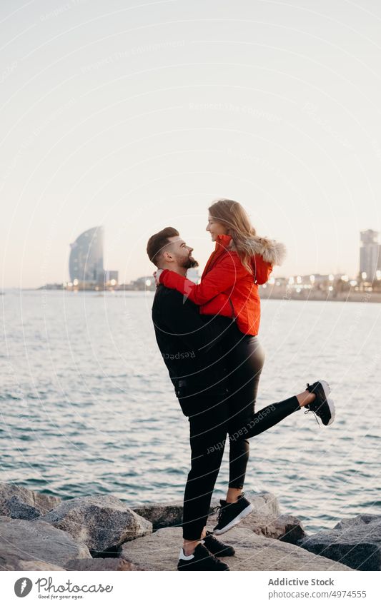 young romantic couple in beach love barcelona holding hands smiling dating winter guy girl people friends laughing happy woman boyfriend cold girlfriend fun