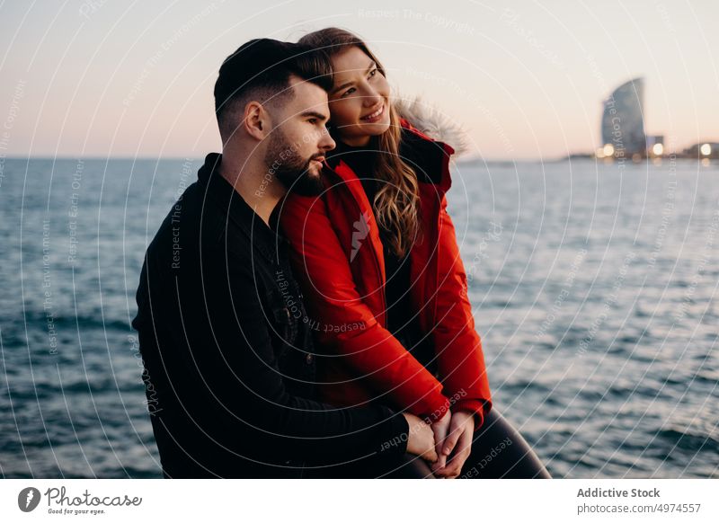 young romantic couple holding hands in beach love barcelona smiling dating winter guy girl people friends laughing happy woman boyfriend cold girlfriend fun