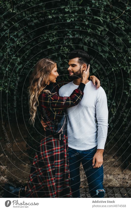young affectionate couple in the street happy love city man woman laughing dating girl romantic family hugging looking people smiling romance falling
