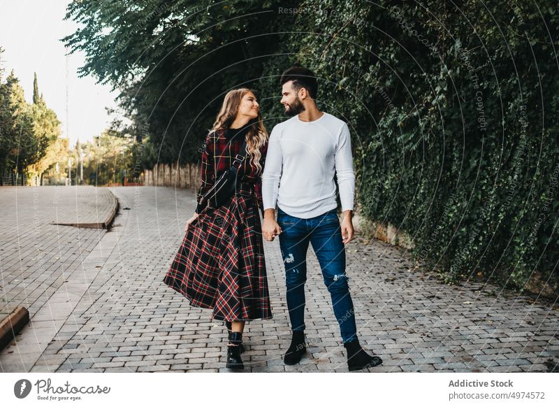 young affectionate couple in the street happy love city man woman laughing dating girl romantic family hugging looking people smiling romance falling