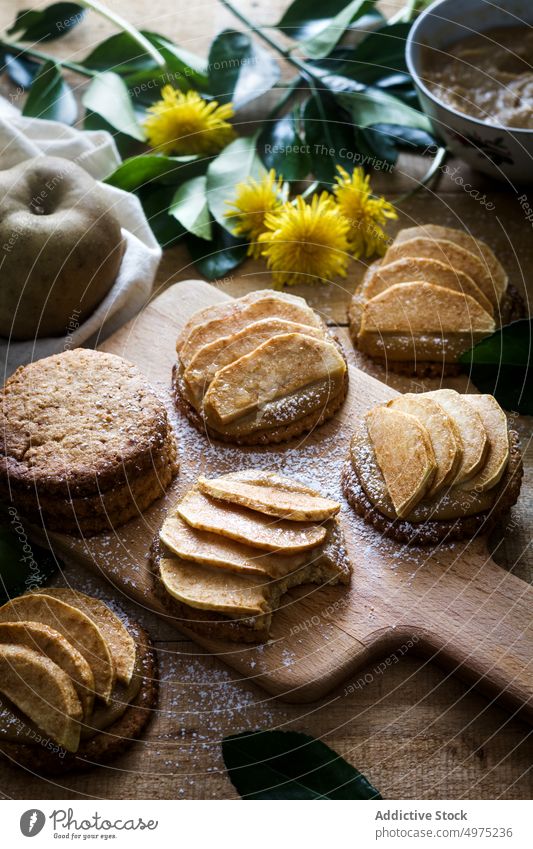 Cookies with apples on table tartlet cookie dessert kitchen home food cutting board dandelion delicious slice meal tasty fresh yummy sieve biscuit gourmet