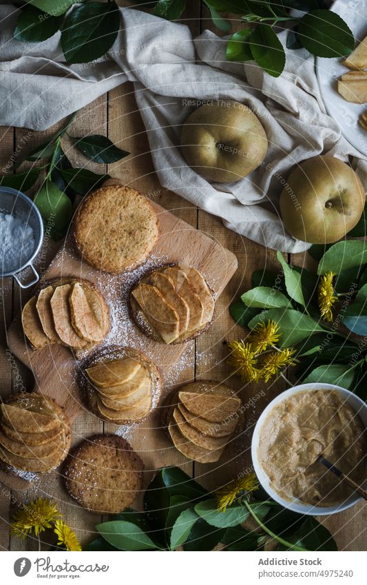 Cookies with apples on table tartlet cookie dessert kitchen home food cutting board dandelion delicious slice meal tasty fresh yummy sieve biscuit gourmet