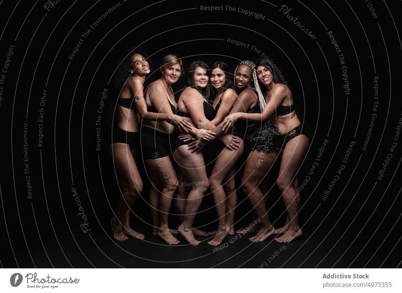 Group of happy multiethnic women in underwear body positive diverse group hug mother different portrait concept female slim plus size multiracial black