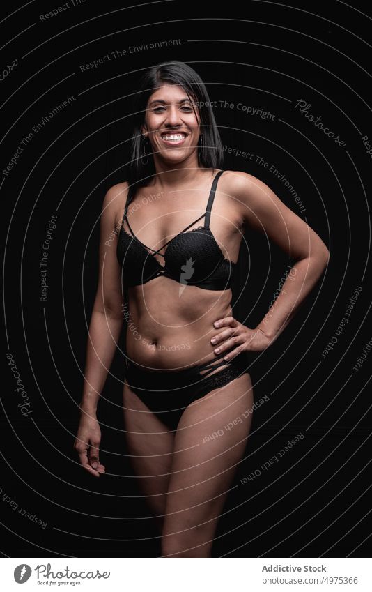 Overweight ethnic woman in lingerie in studio plus size underwear smile positive confident brunette happy body positive style outfit female young modern