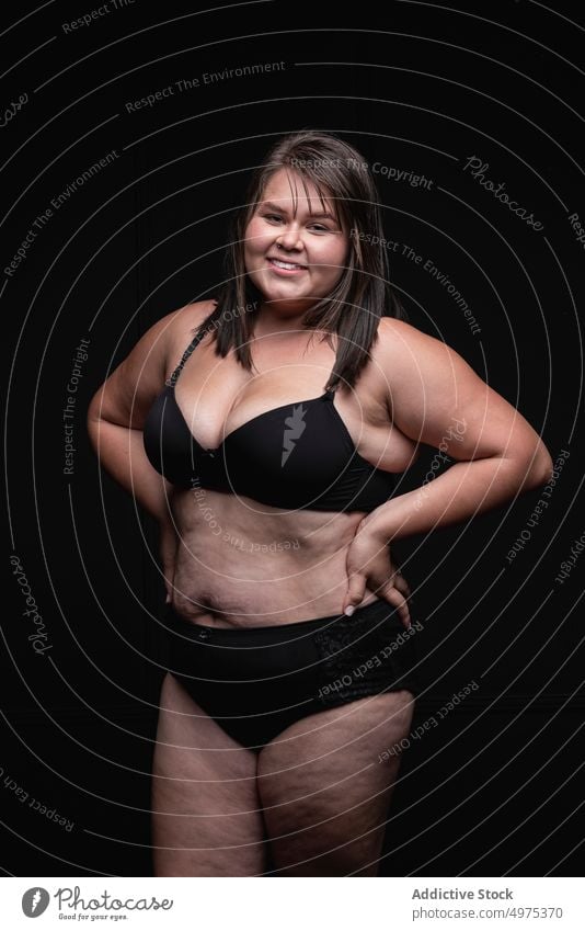 Overweight woman in lingerie in studio plus size underwear smile positive confident brunette happy body positive style outfit female young modern cheerful