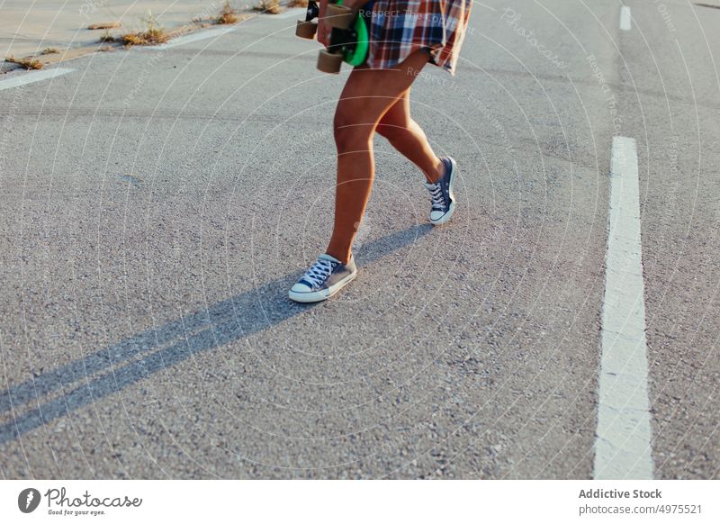 Ethnic woman with penny board road hipster summer skater afro sunset legs millennial female ethnic african american black trendy stand city chill urban charming