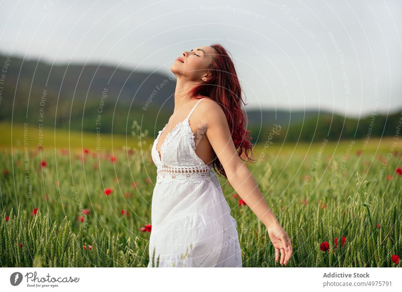 Dreamy model with flying hair against mount in field breathe mindfulness life highland nature landscape woman dreamy windy weather mountain farmland feminine