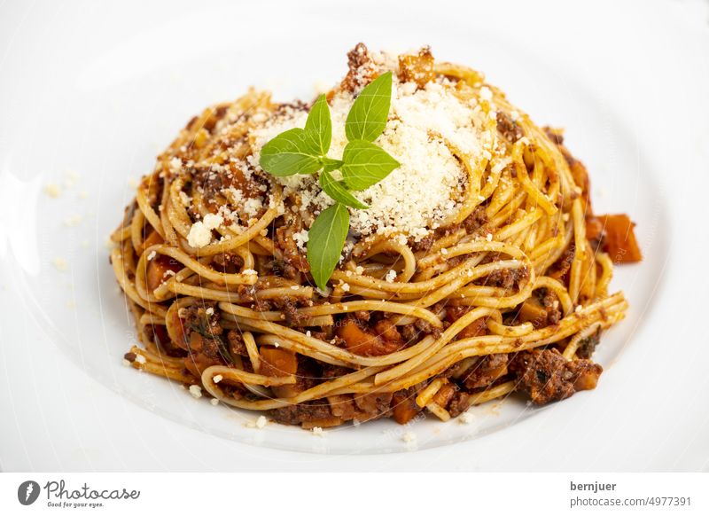 Spaghetti with Bolognaise sauce on white Tomato Minced meat Heap pasta Parmigiano Meat Mediterranean Eating Italian Kitchen Bolognese Beef boil Wheat Cheese