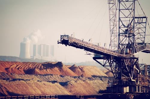 Open pit lignite mine with conveyor bridge, dumps and steam power plant open pit mining Coal hoisting crane power station Coal power station Energy industry