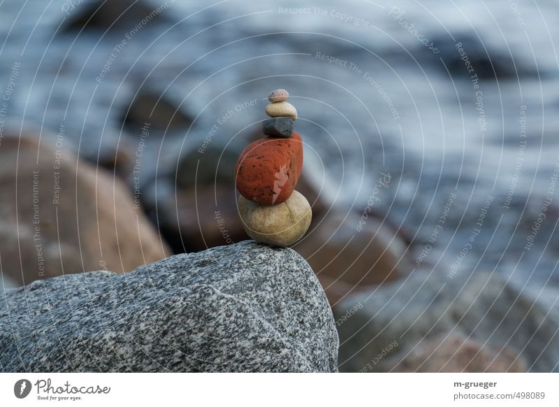 stone man Earth Ocean Baltic Sea Blue Yellow Gray Red Colour photo Subdued colour Exterior shot Close-up Evening Shallow depth of field