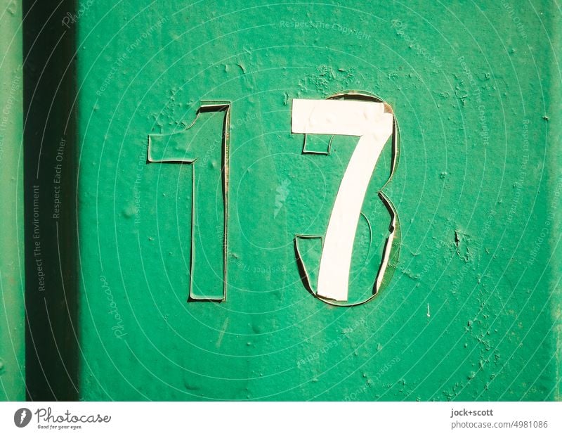 unlucky number 13 becomes lucky number 7 or 17 Change Surface Green Weathered Typography Varnish glued Signs and labeling Authentic Ravages of time Relay