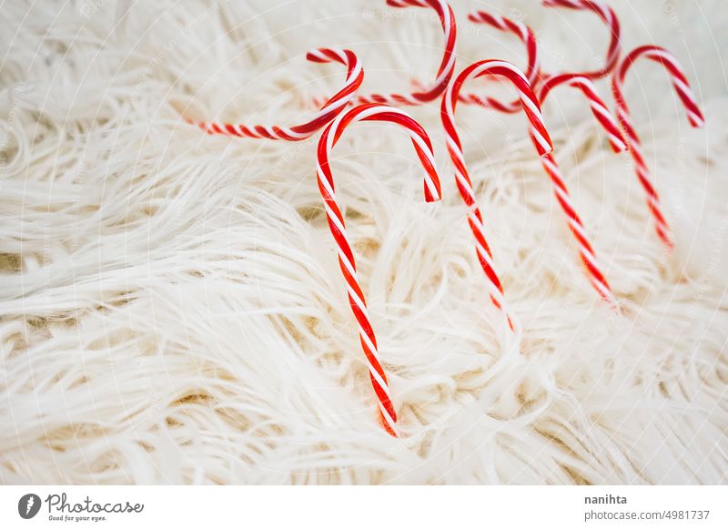Christmas background doing with classic candy canes over a soft carpet christmas red white fluffy event party wallpaper texture sweet food unhealthy lines warm