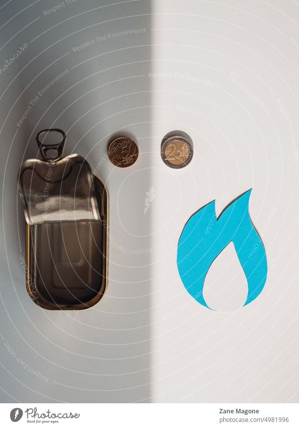 Natural gas symbol and empty tin can,  budgeting household expenses natural gas gas consumption gas money saving natural resources gas economy saving gas