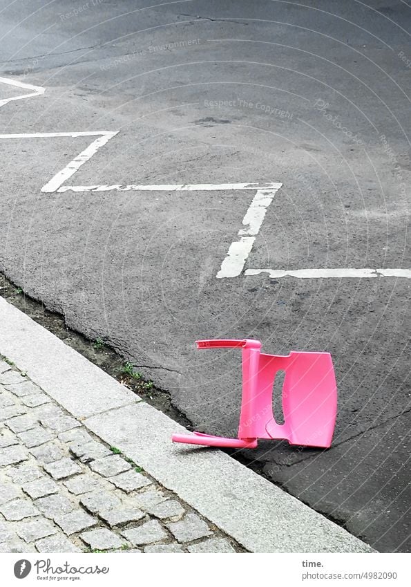 lying pink plastic chair on curb in no parking zone Chair toppled over Plastic Clearway urban Signs and labeling Broken Plastic chair Floor covering Line
