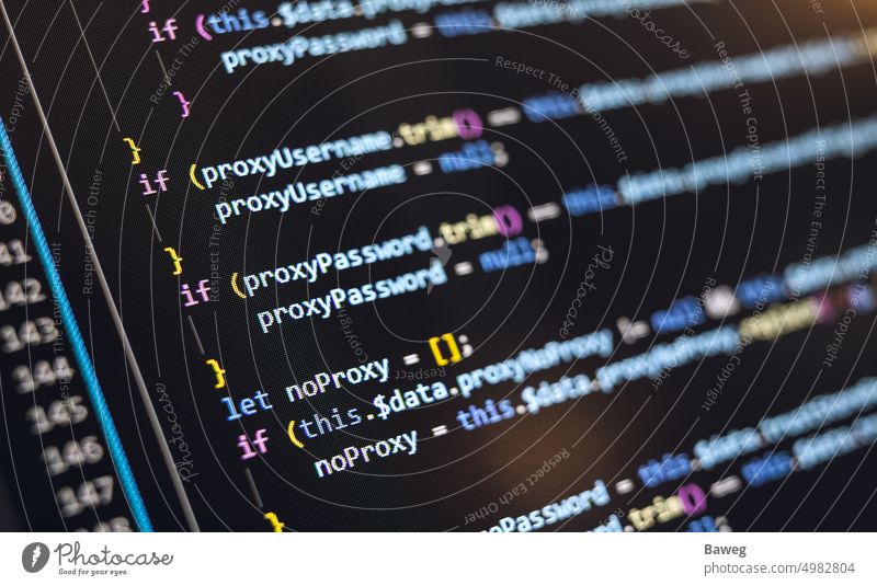 Close-up of screen showing software code javascript software development web development vue react angular app application black blur business close up close-up
