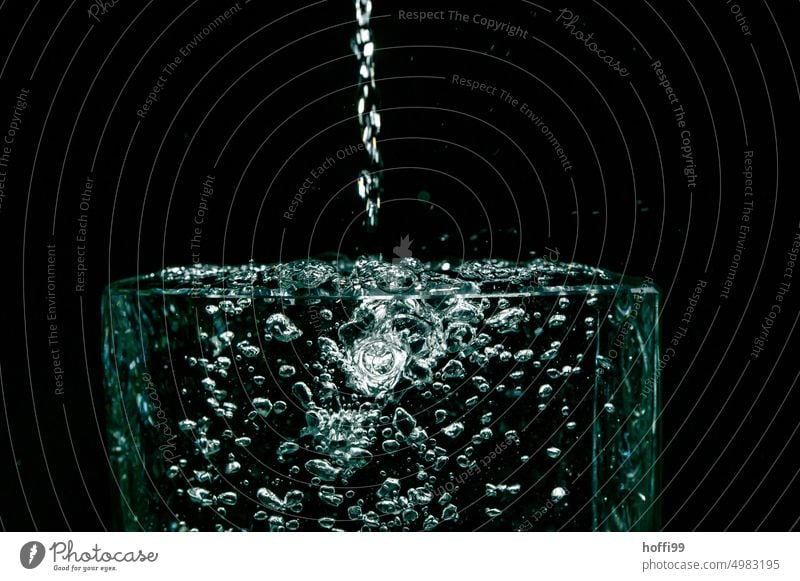 Drops fall into the water and leave traces Drops of water Water Hover Inject Surface of water Flash photo To fall Black Refraction hovering Glittering Abstract