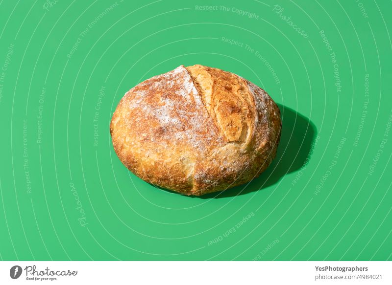 Homemade white bread minimalist on a green background above artisan baked bakery bright brown carbs close-up color crust cuisine delicious food fresh golden