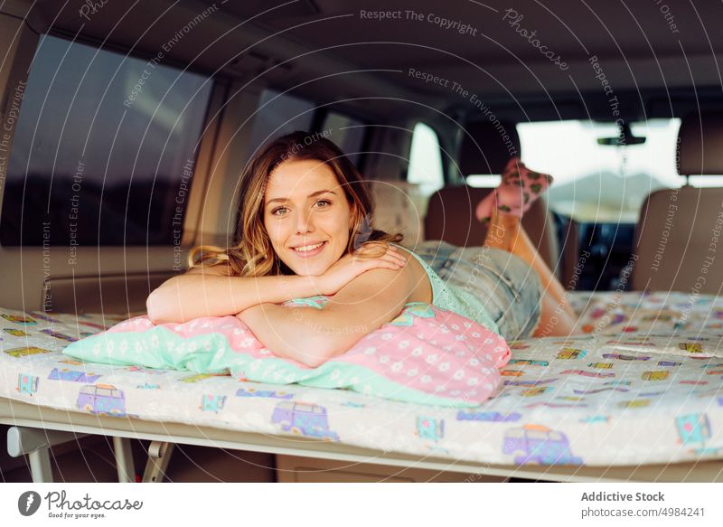 Blonde pretty woman resting in a caravan trip people travel summer happy lying road smiling young sun transportation teenage caucasian vacation lifestyle